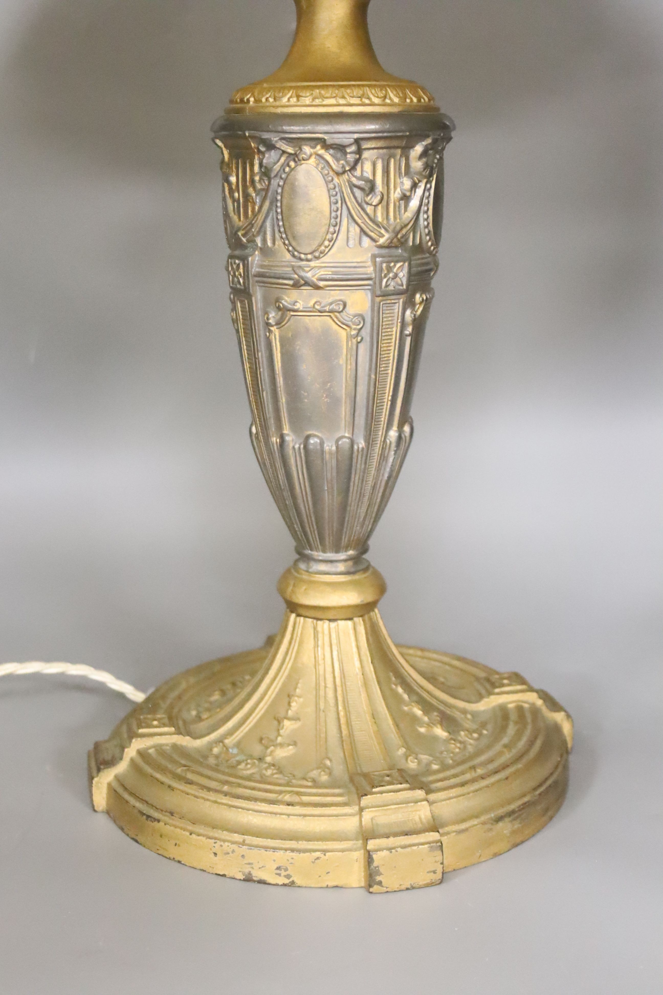 A Louis XVI style gilt shelter table lamp with octagonal slag glass shade
